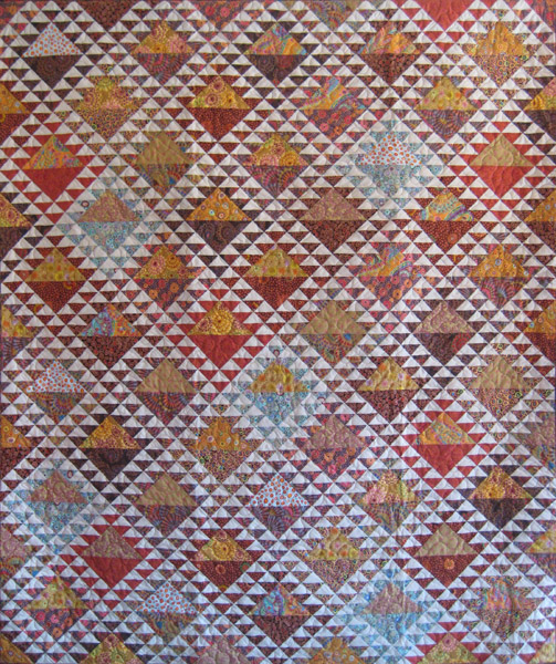 Vibrant patchwork of reds and golds